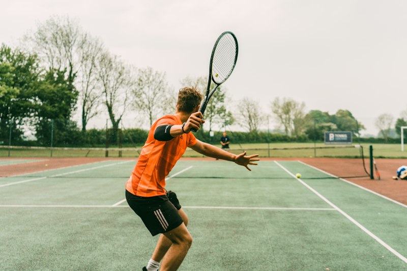 A player reaching for a tennis shot
